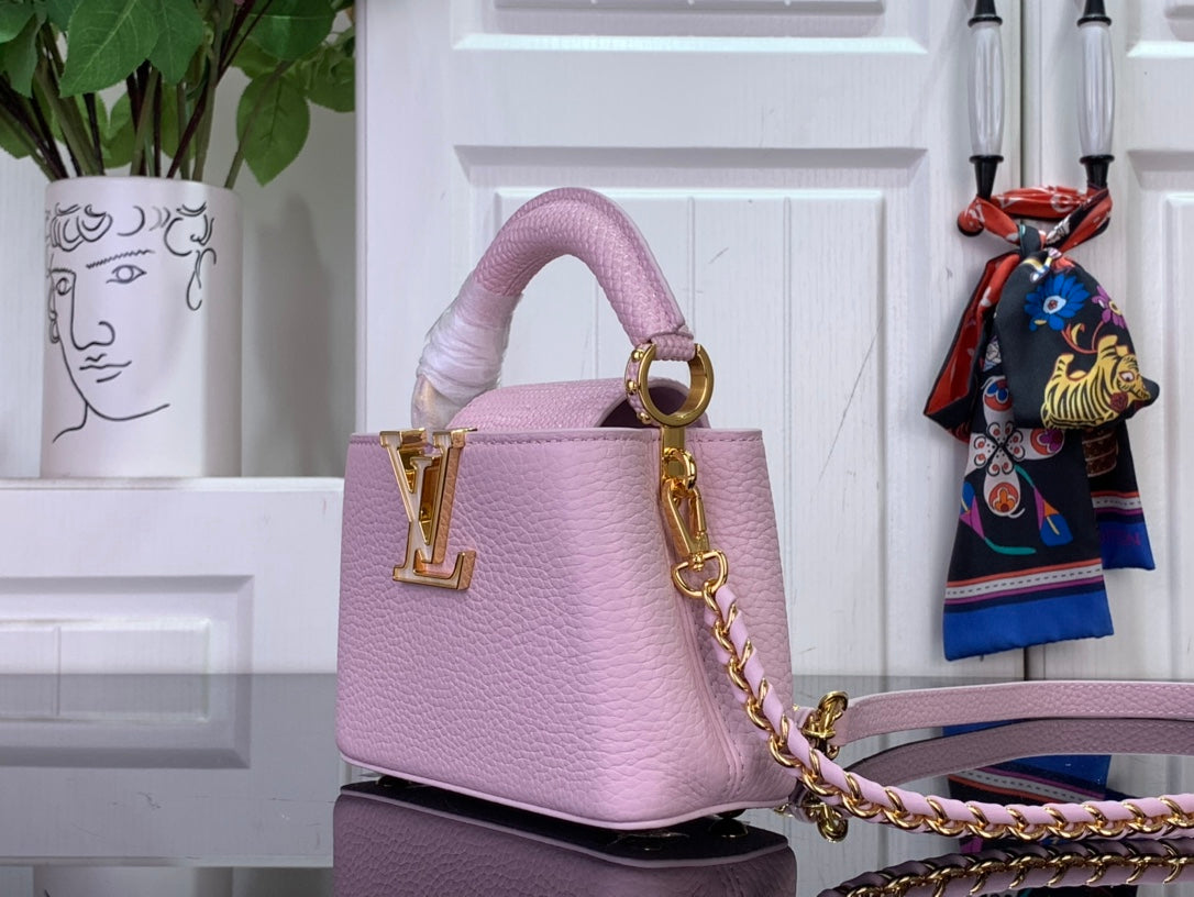 Louis Vuitton bag in light pink textured leather, gold LV hardware, chain strap