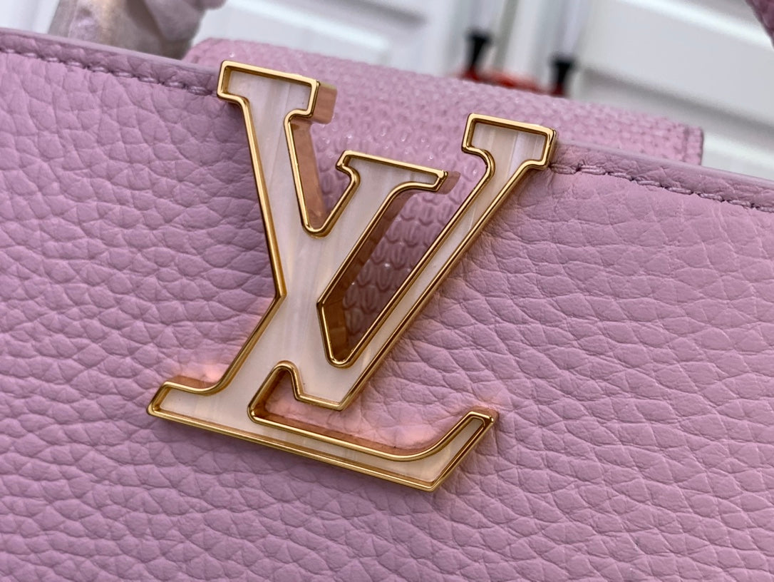 Louis Vuitton LV logo on light pink textured leather, gold-tone metal hardware