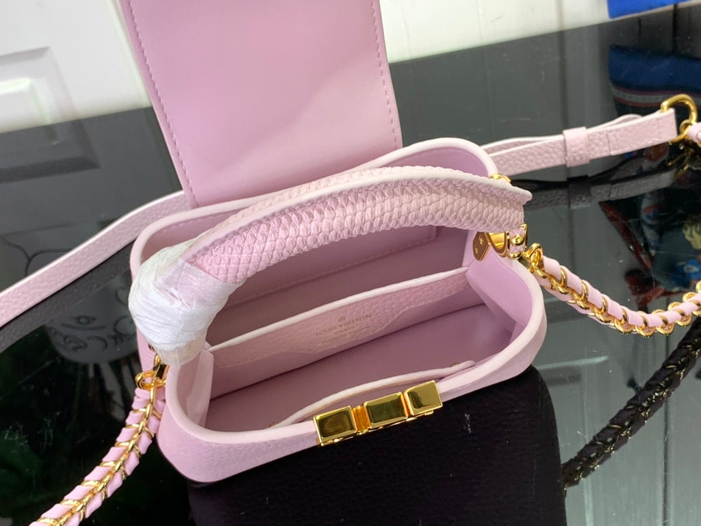 Louis Vuitton bag interior view, light pink leather with strap and gold buckle