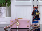 Louis Vuitton bag in light pink textured leather, front clasp with gold hardware