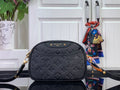 Louis Vuitton monogram crossbody bag, dark leather with embossed pattern, gold hardware