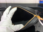 Louis Vuitton crossbody bag interior, gold zipper and dark fabric lining