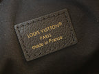 Louis Vuitton leather patch: made in France, gold Louis Vuitton Paris text