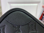 Louis Vuitton embossed leather corner with monogram pattern and stitched trim