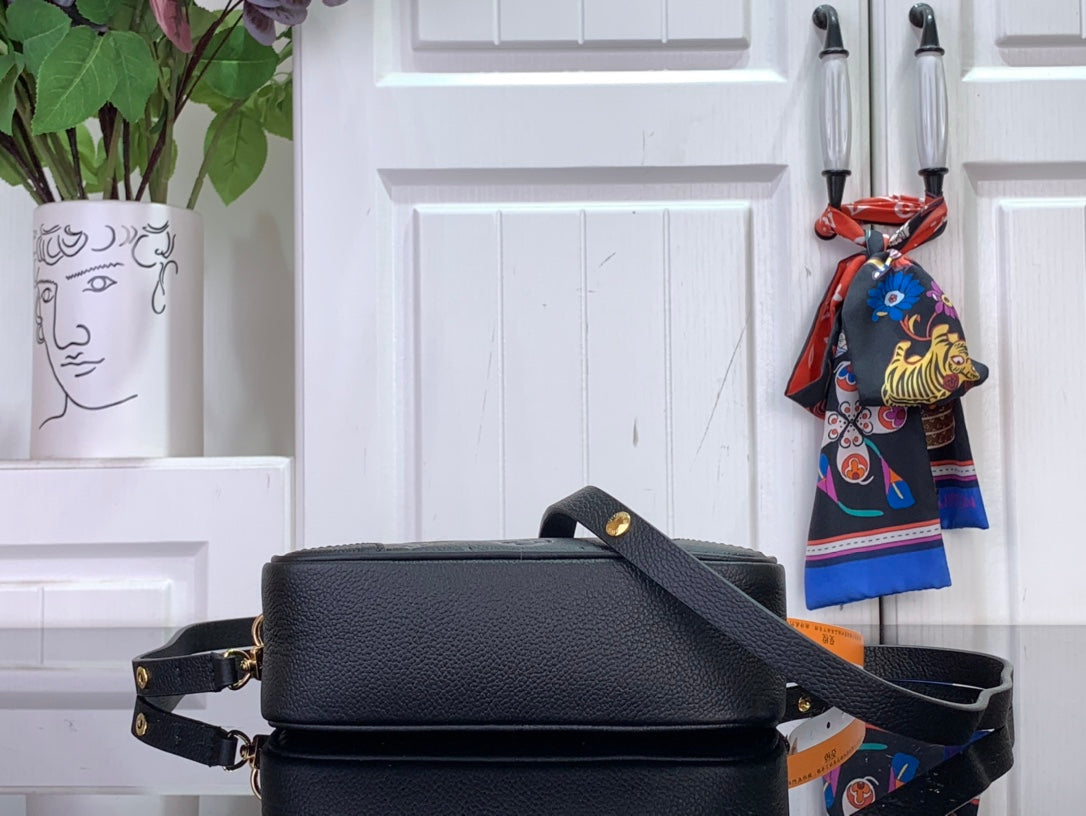 Louis Vuitton crossbody bag, smooth dark back with strap and gold hardware