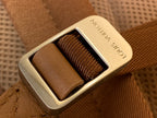 Louis Vuitton snap buckle on tan leather strap, engraved metal plate