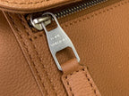 Louis Vuitton tan leather zipper pull with metal logo and stitched panel