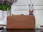 Louis Vuitton men’s flap backpack in tan leather with top handle and stitched front panel