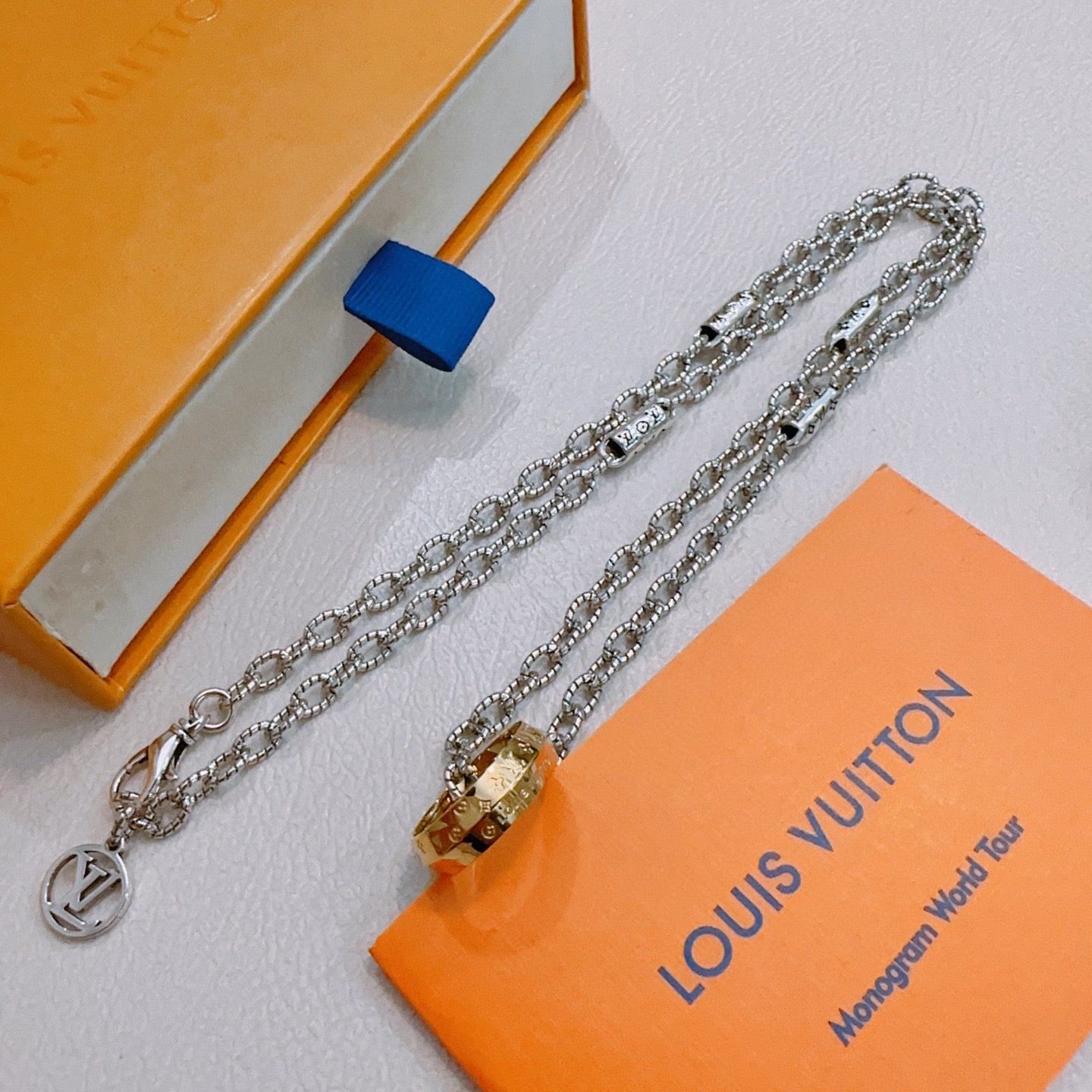 Silver-tone chain necklace set with round and lock-shaped pendants