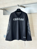 Chrome short long-sleeve jersey top in dark charcoal with front graphic logo and V-neck