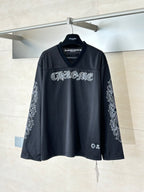 Chrome short long-sleeve jersey top in dark charcoal with front graphic logo and V-neck
