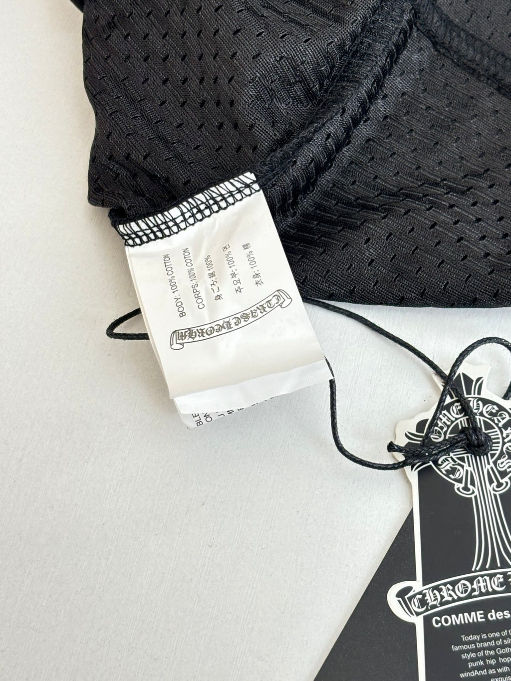 Black patterned shorts with size label and drawstring waist detail