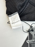 Black patterned shorts with size label and drawstring waist detail