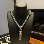 Chrome chain necklace with faceted capsule pendant and small top clasp