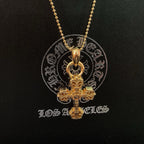 Gold tone cross pendant necklace with beaded chain and round seal medallion