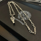 Silver-tone chain necklace with two pendants on black box