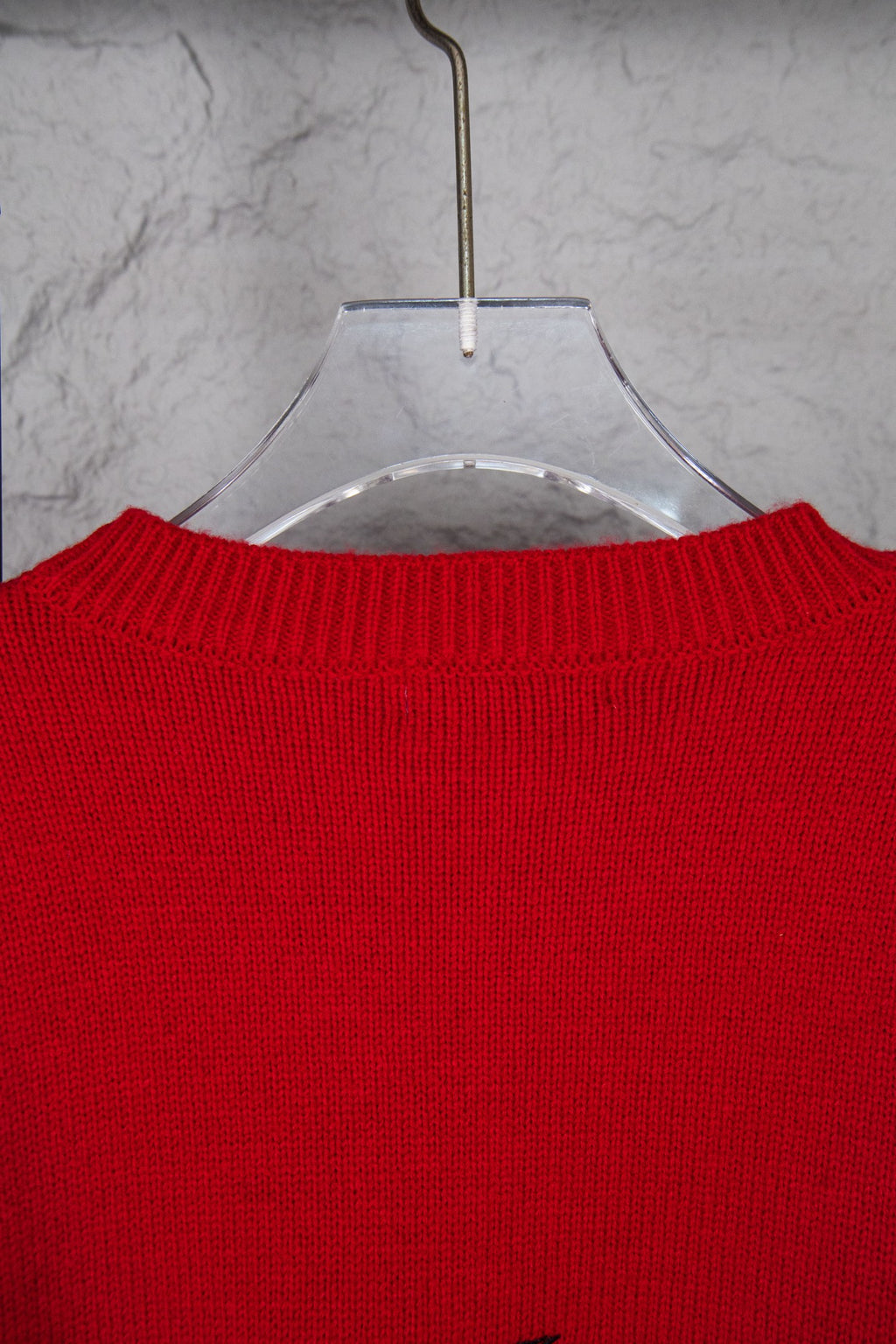 Red crewneck sweater neckline with ribbed collar detail