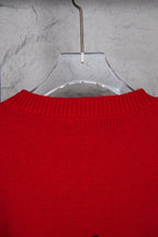 Red crewneck sweater neckline with ribbed collar detail