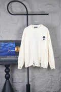 Cream long-sleeve sweater with crewneck and small black logo on front