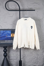 Cream long-sleeve sweater with crewneck and small black logo on front