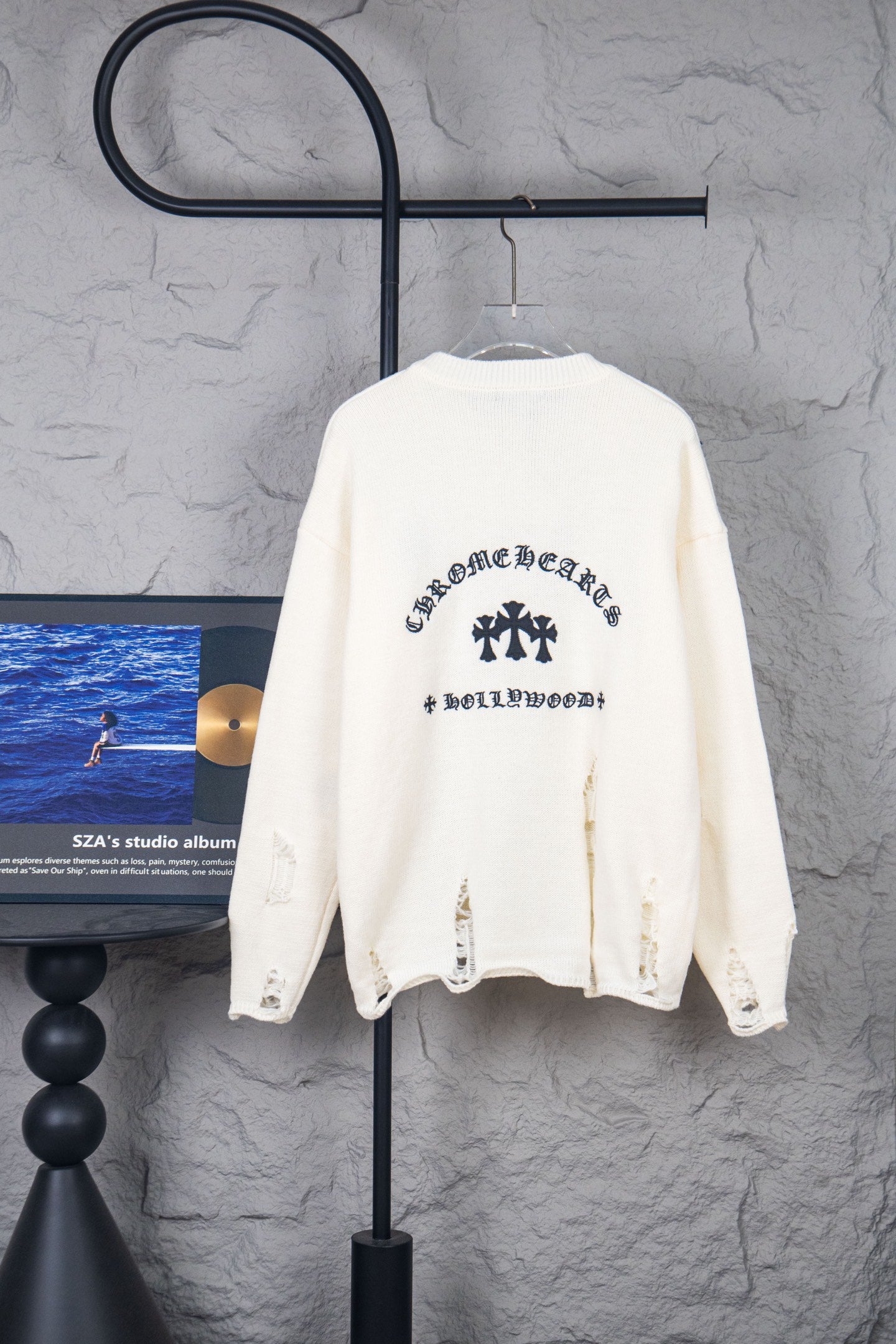 Cream long-sleeve sweater with crewneck and graphic print on back