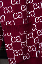 Gucci burgundy knit sweater with ribbed hem and repeating white GG pattern
