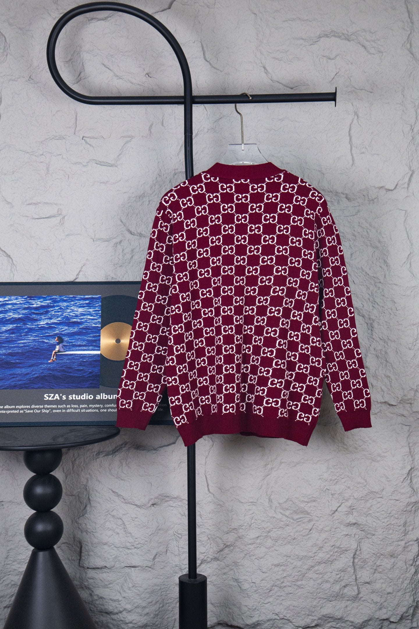 Gucci long-sleeve knit sweater with burgundy body and white GG logo pattern