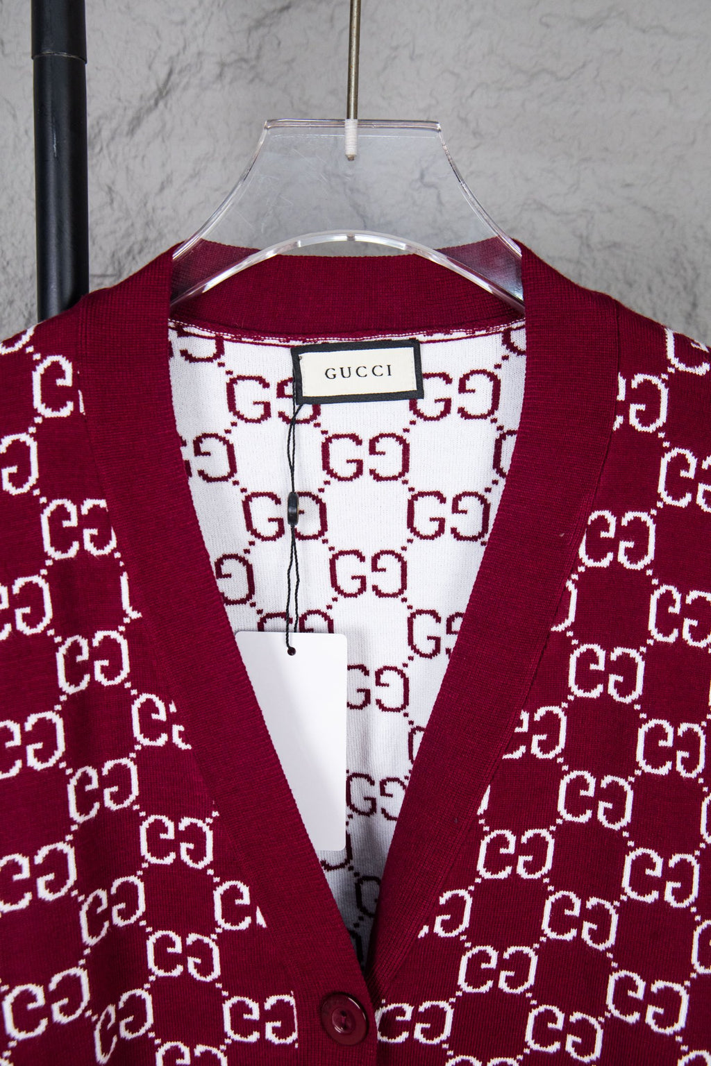 Gucci knit sweater neckline with burgundy V-shape trim and white GG monogram pattern