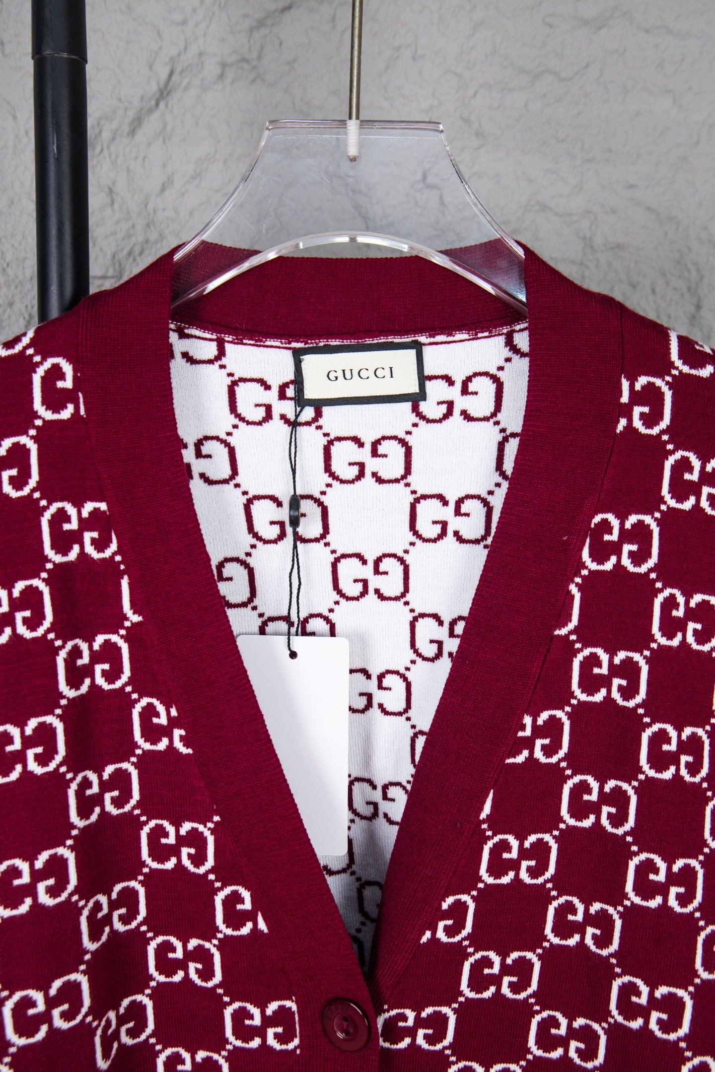 Gucci knit sweater neckline with burgundy V-shape trim and white GG monogram pattern