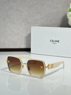 Celine sunglasses with light frames and amber-tinted lenses, gold-tone logo detail