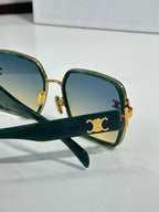 Celine sunglasses detail view of dark green frames, gold hinge and logo emblem