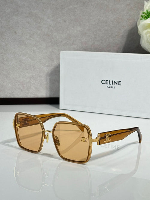 Celine sunglasses with gold frames and amber lenses, gold-tone logo on arms