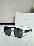 Celine sunglasses with dark frames and black lenses, gold-tone logo on arms