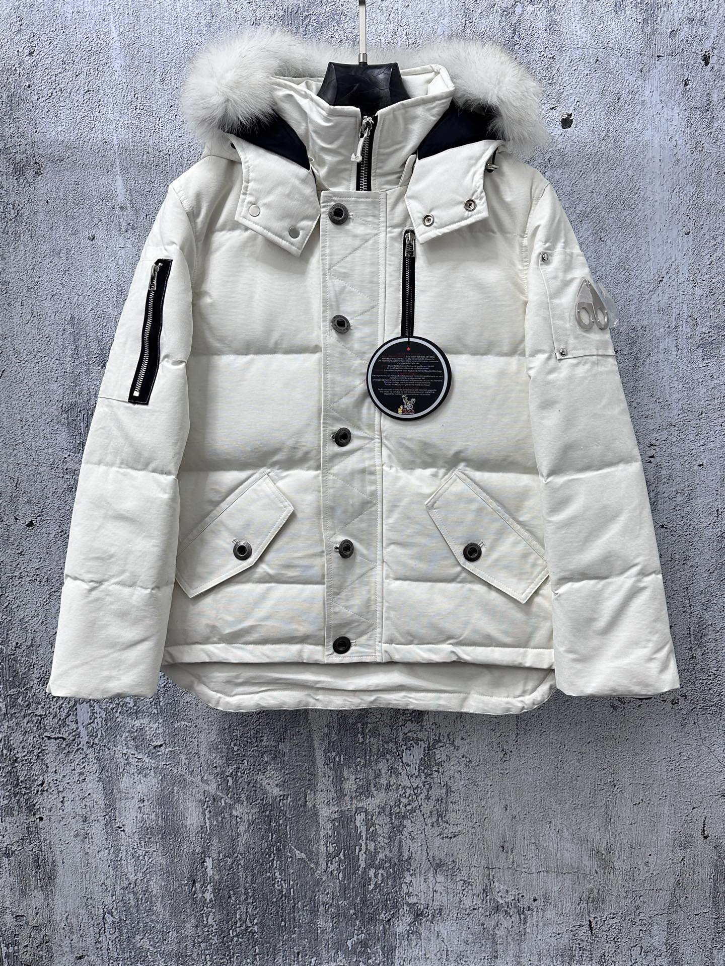 Moncler long white puffer jacket with faux fur hood and front zipper