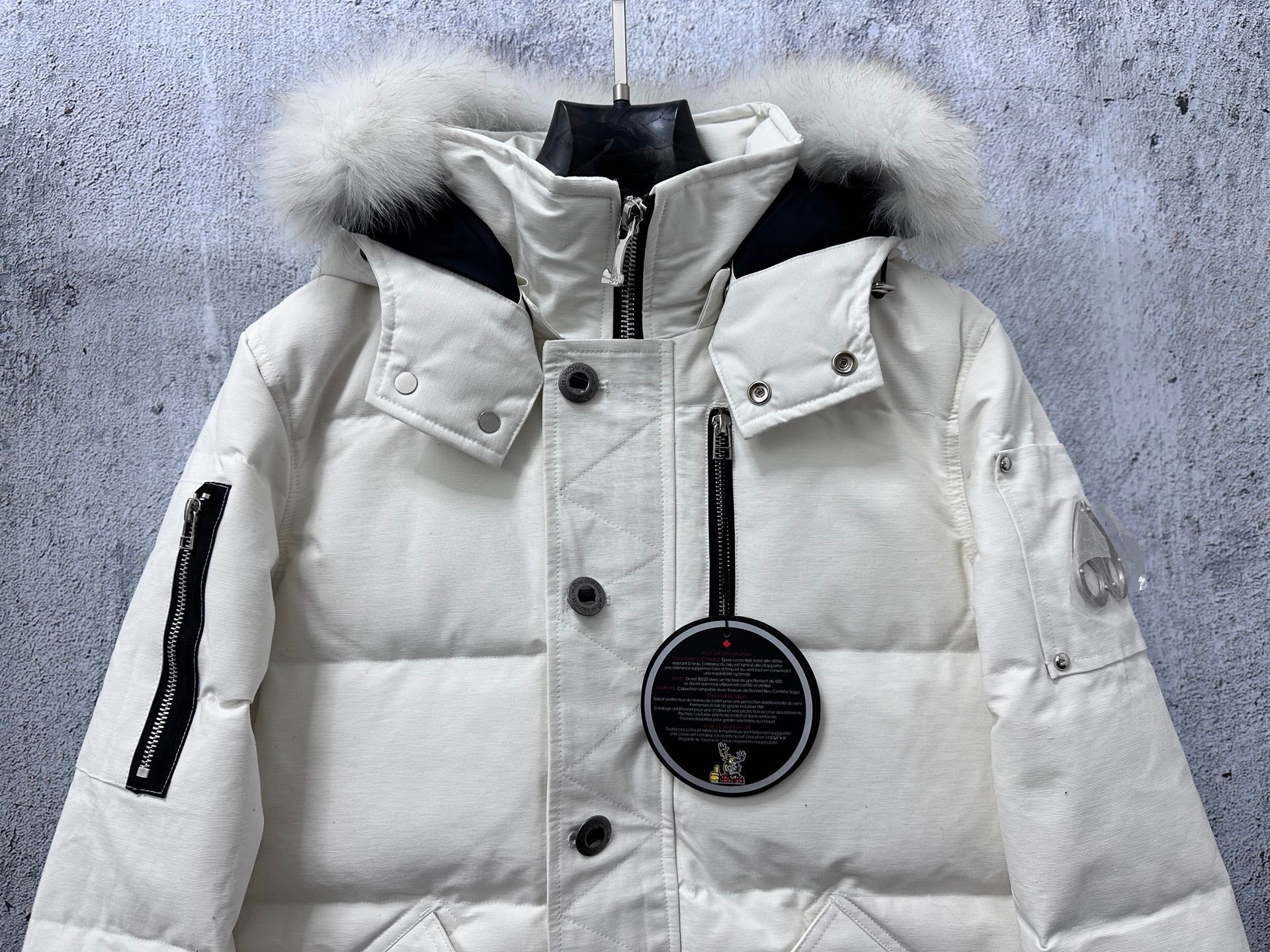 White long puffer jacket with fur-trim hood, snap front, stand collar, zipper