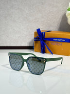 Louis Vuitton sunglasses, green frames, light lenses with LV monogram