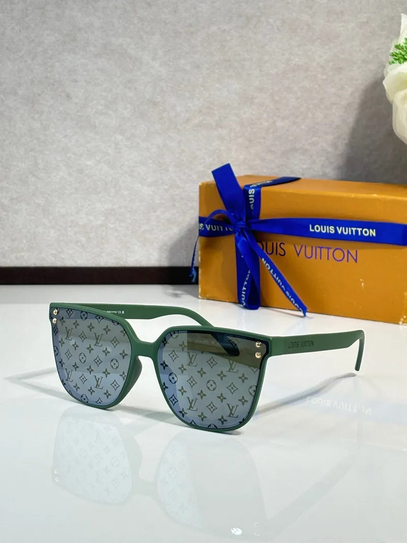 Green monogram sunglasses with gray lenses and light mint green square frames.