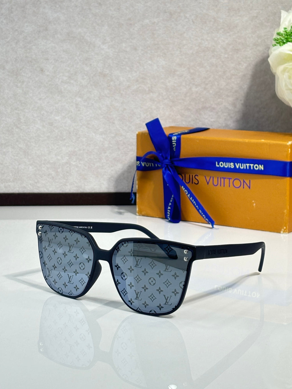 Louis Vuitton sunglasses, dark blue frames, blue tinted lenses with LV monogram