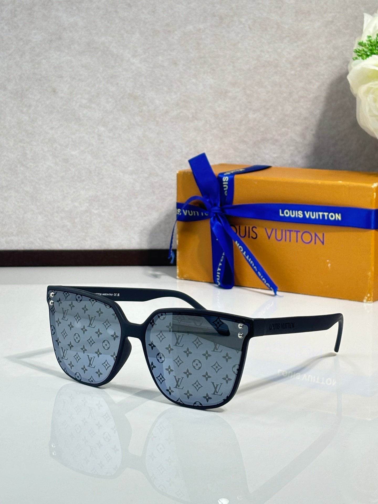 Louis Vuitton sunglasses, dark blue frames, blue tinted lenses with LV monogram