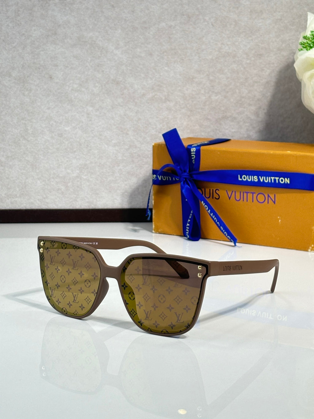 Louis Vuitton sunglasses, tan frames, brown tinted lenses with LV monogram
