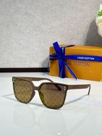 Louis Vuitton sunglasses, tan frames, brown tinted lenses with LV monogram