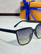 Louis Vuitton sunglasses close-up, black frames, LV monogram on lens