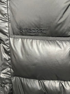 Burberry logo patch on black puffer jacket front panel