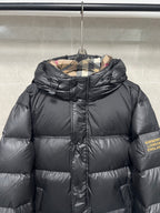 Black puffer jacket with chin-guard zipper and hood, Burberry England label