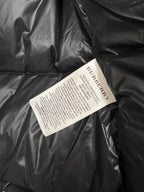 Burberry care label tag on black puffer jacket interior lining