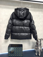 Black puffer jacket, rear view with quilted horizontal baffles and hood
