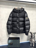 Black puffer jacket with full zipper and standing collar, quilted panels