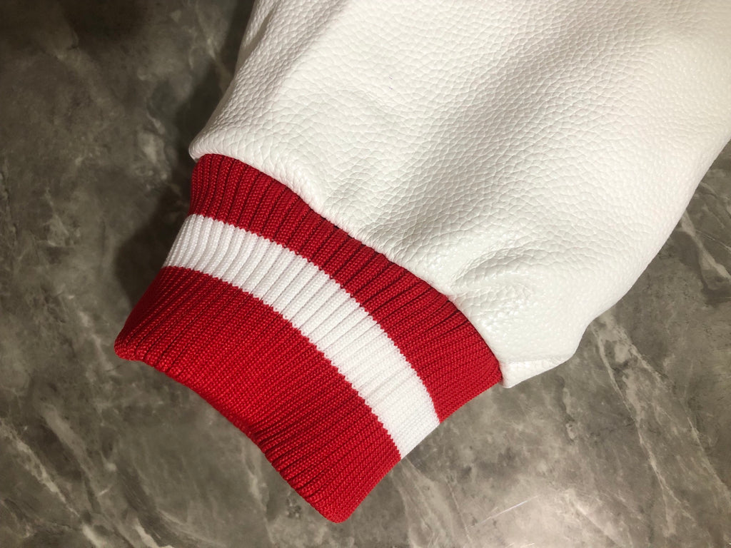 Givenchy red and white ribbed striped cuff on white sleeve