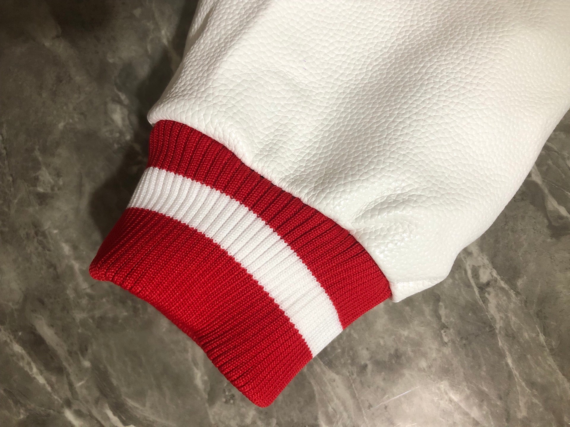 Givenchy red and white ribbed striped cuff on white sleeve