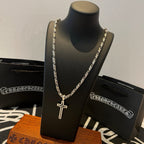 Cross pendant necklace with silver-tone chain and sword-shaped pendant on bust